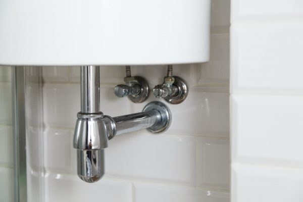 Basin siphon or sink drain in a bathroom, clean